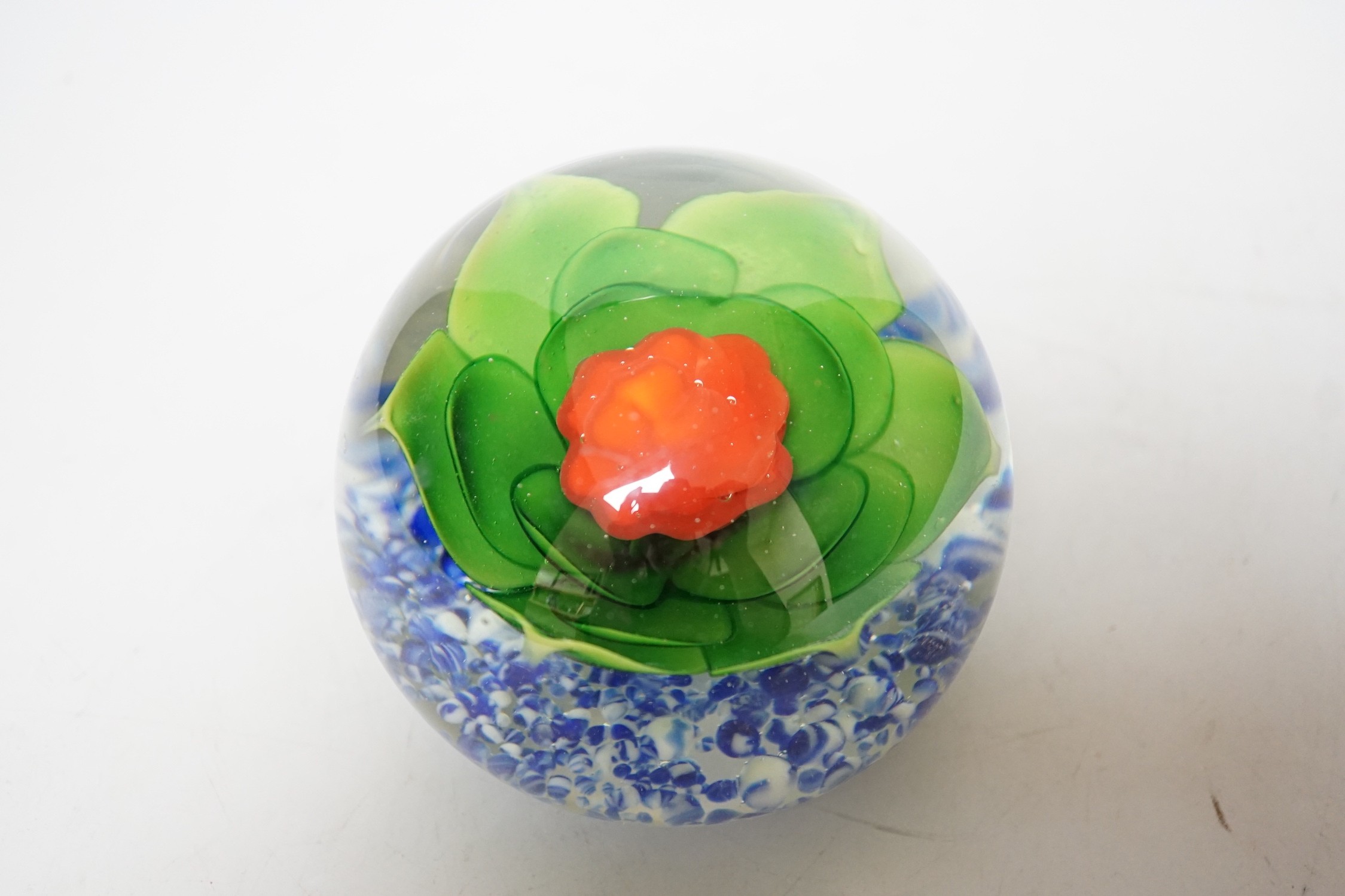 A large floral glass paperweight, 9cm tall